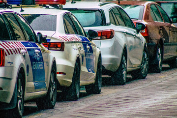 Closeup of an official police car patrolling the streets of the city center of the metropolitan area  © ahinoam