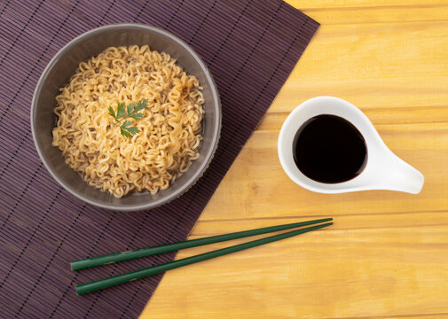 Lamen on a bowl with hashi and soy sauce