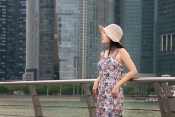 Lovely girl traveling in Singapore.Lovely girl traveling in Marina Bay, Singapore.Beautiful woman traveling in Singapore.