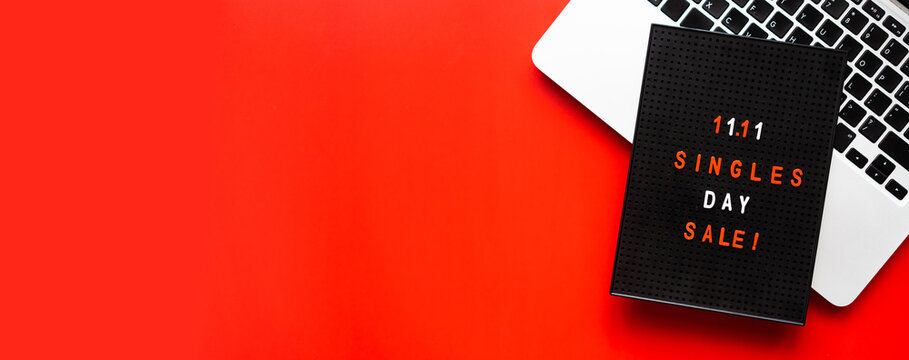 11.11 singles day flat lay with laptop on table.Singles day in 11 november in china holiday for shop and mega sale.Discount and promotion banner background template design for application and website.