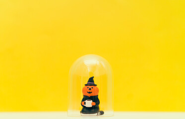 jack o lantern holding coffee cup stay home yellow background.Stay home stay safe lockdown at home.Relax in holidays halloween party online.Protection from coronavirus covid19 pandemic.Pumpkin witch