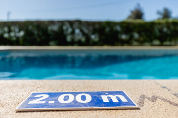blue plastic plate indicating a depth of 2.00 meters
