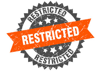 restricted stamp. grunge round sign with ribbon