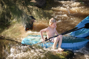 Boy kayaking Goulburn River, New South Wales Australia. Adventure holiday family road trip.