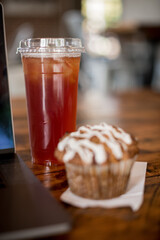 Iced tea with muffin at coffee shop