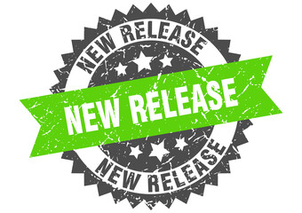 new release stamp. grunge round sign with ribbon