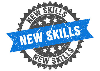 new skills stamp. grunge round sign with ribbon