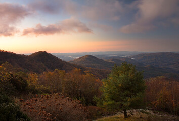 Endless layers of fog and trees within the blue ridge mountains of north carolina. Overlooks give way to a sea of mountains and hills filled with fall color during colorful sunrise and sunsets.