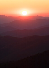 Endless layers of fog and trees within the blue ridge mountains of north carolina. Overlooks give way to a sea of mountains and hills filled with fall color during colorful sunrise and sunsets.
