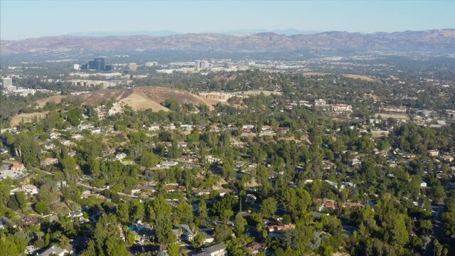 Looking toward Warner Center and Topping San Fernando Valley Woodland Hills Suburbs Los Angeles California Drone View