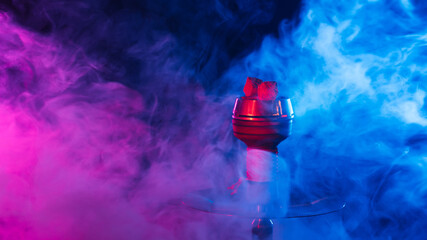 hookah red hot coals for shisha in a bowl against a background of smoke - obrazy, fototapety, plakaty