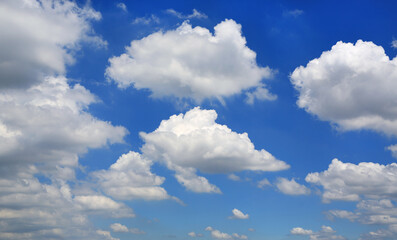 Beautiful blue sky with white fluffy cloud background