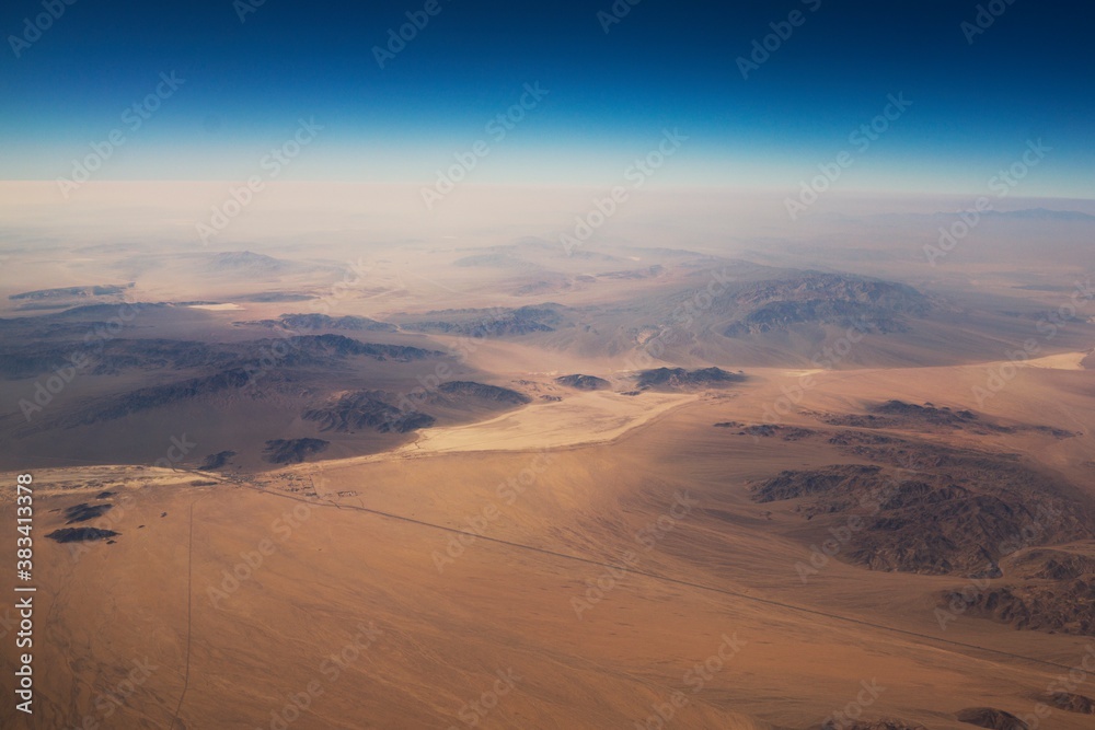 Wall mural this aerial image shows a breathtaking view of vast desert landscape. - Wall murals