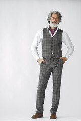 Close up portrait of grinning old-fashioned man. Elegant man in a studio. Grandfather with a clock.