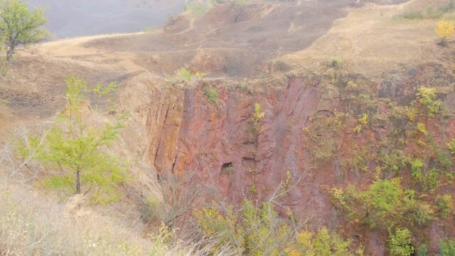 Failed quarry iron ore mine, mine construction. Industrial mining conveyor red iron ore Krivoy Rog Ukraine.