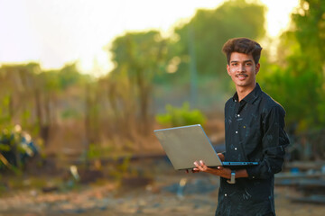 Young indian boy using laptop
