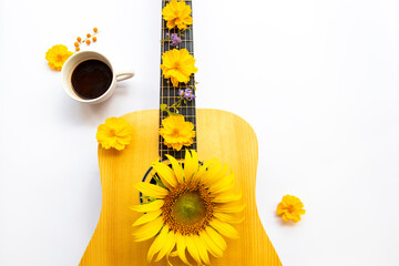 hot cocoa, guitar and yellow flowers cosmos, sunflowers of lifestyle arrangement flat lay postcard...