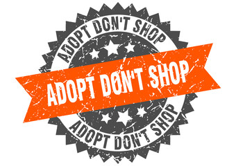 adopt don't shop stamp. grunge round sign with ribbon