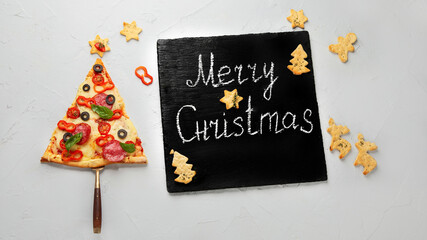 Fototapeta na wymiar Piece of pizza set like christmas tree.