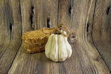 Decorative white pumpkin and a stack of hey