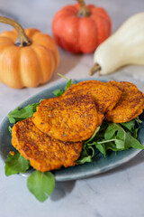 healthy home made pumkin patties with avocado and arugula salad