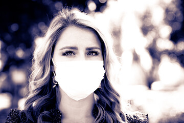 Close up Portrait of Beautiful Women in Medical Mask, 30 years Old  with blonde Hair and Big Blue Eyes, Pandemic 2020
