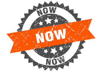 now stamp. grunge round sign with ribbon