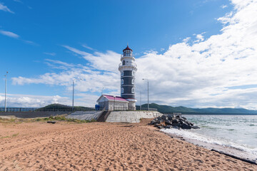A lighthouse and an observation deck in the tourist area of the Baikal backwater at the confluence of the Turka river into Lake Baikal