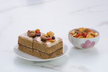 Coffee cakes with toppings on white marble board