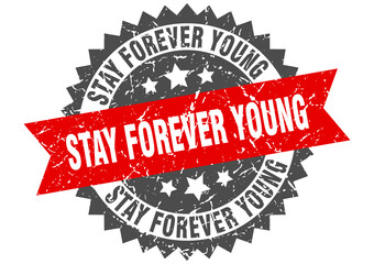 stay forever young stamp. grunge round sign with ribbon