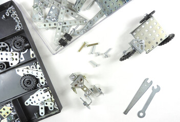  Screw driver, nuts, wrench, bolts and parts of children's metallic constructor. children's metal kit. 