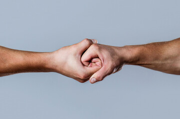Male hand united in handshake. Man help hands, guardianship, protection. Two hands, isolated arm,...