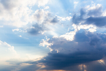 White cumulus clouds and a blue sky.