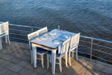 Sea view beach restaurant at sunset in  Akyarlar beach, Bodrum, Turkey.