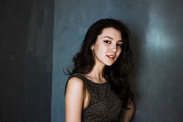 Fototapeta premium Black hair woman. Beautiful brunette hairstyle fashion portrait over dark background