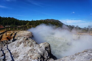 Photography of the Sikidang crater with the background of sulfur vapor coming out of the sulfur swamp, Tour from Wonosobo.