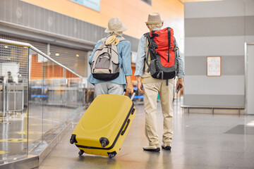 Fototapeta na wymiar Two Caucasian elderly travelers standing at the airport