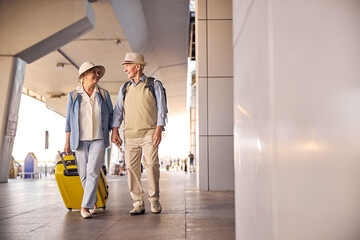 Senior tourist couple in love holding hands - Powered by Adobe