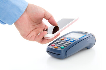 Hand holding mobile phone and scanning payment on pos machine on white background