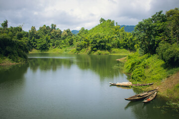 Beautiful landscape of lake with some boat in a mountain