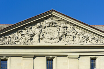 sculpture of coat of arms on a facade of the old town of Bern, Switzerland