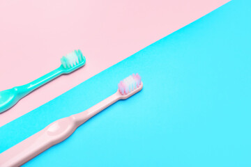 Tooth brushes on color background