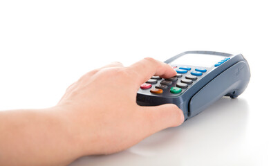A hand on a white background is entering the payment amount on the POS machine
