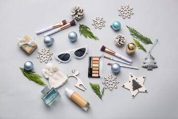 Fototapeta na wymiar Christmas composition with cosmetics on light background