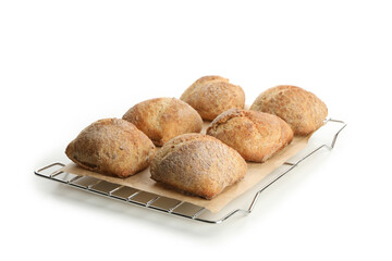 Fresh baked buns on cooling rack isolated on white background