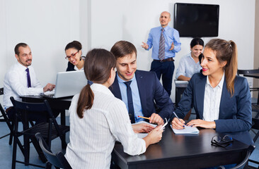 Positive efficient employeesin office on business meeting