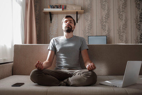 Millennial Hipster Guy Enjoy No Stress Peace Of Mind Lounge On Sofa At Home