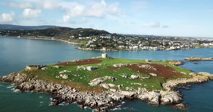 Aerial reveal of Dalkey Island with Killiney Hill and mainland Ireland behind.