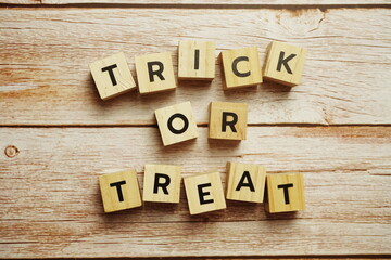 Trick or Treat alphabet letters Halloween festive on wooden background