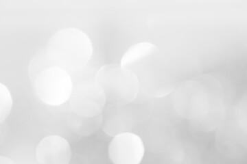 A brilliant white background with circles and ovals. Template for a holiday card with bright and sparkling lights.